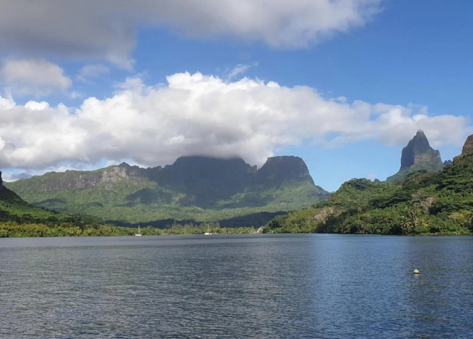 View across a Moorea bay toward the island's jagged peaks