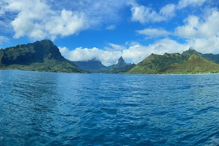 Moorea's green peaks and bay seen from the open water