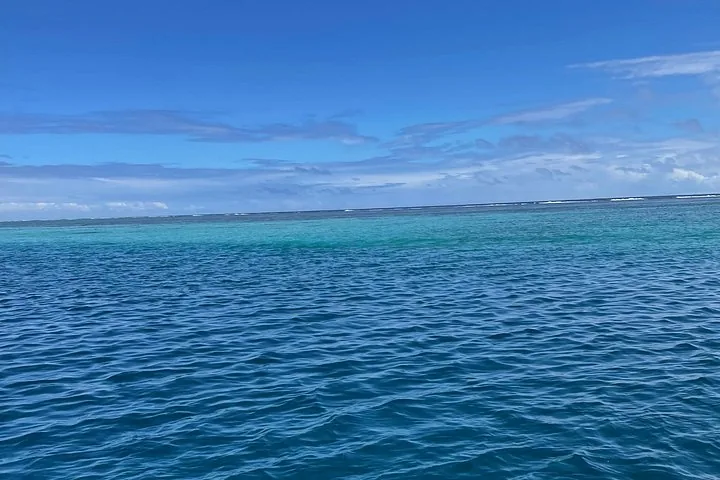 Open ocean beyond Moorea's reef, with waves breaking on the reef line